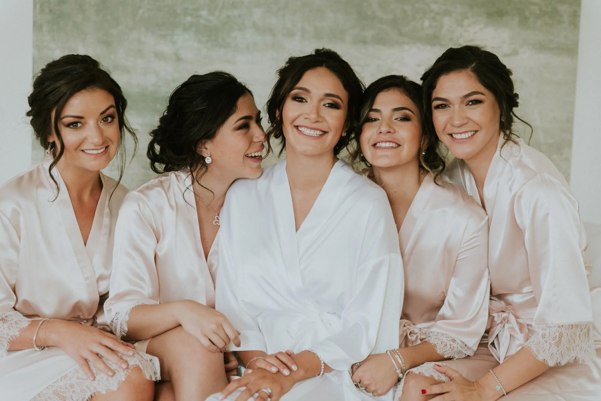 Bridesmaids in satin robes at Schloss Neuhardenberg