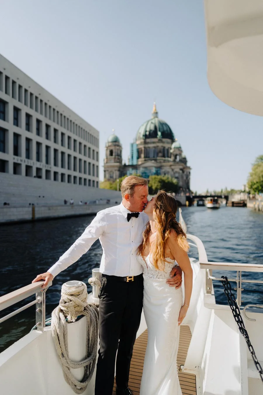 Couple kissing on a boat in Berlin