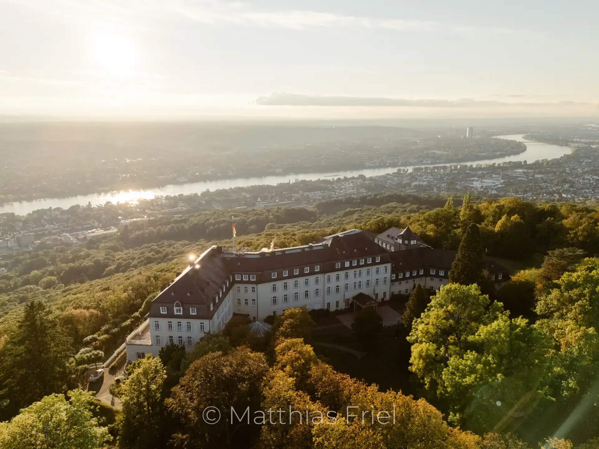 Aerial view of Grandhotel Petersberg above the Rhine valley at sunset