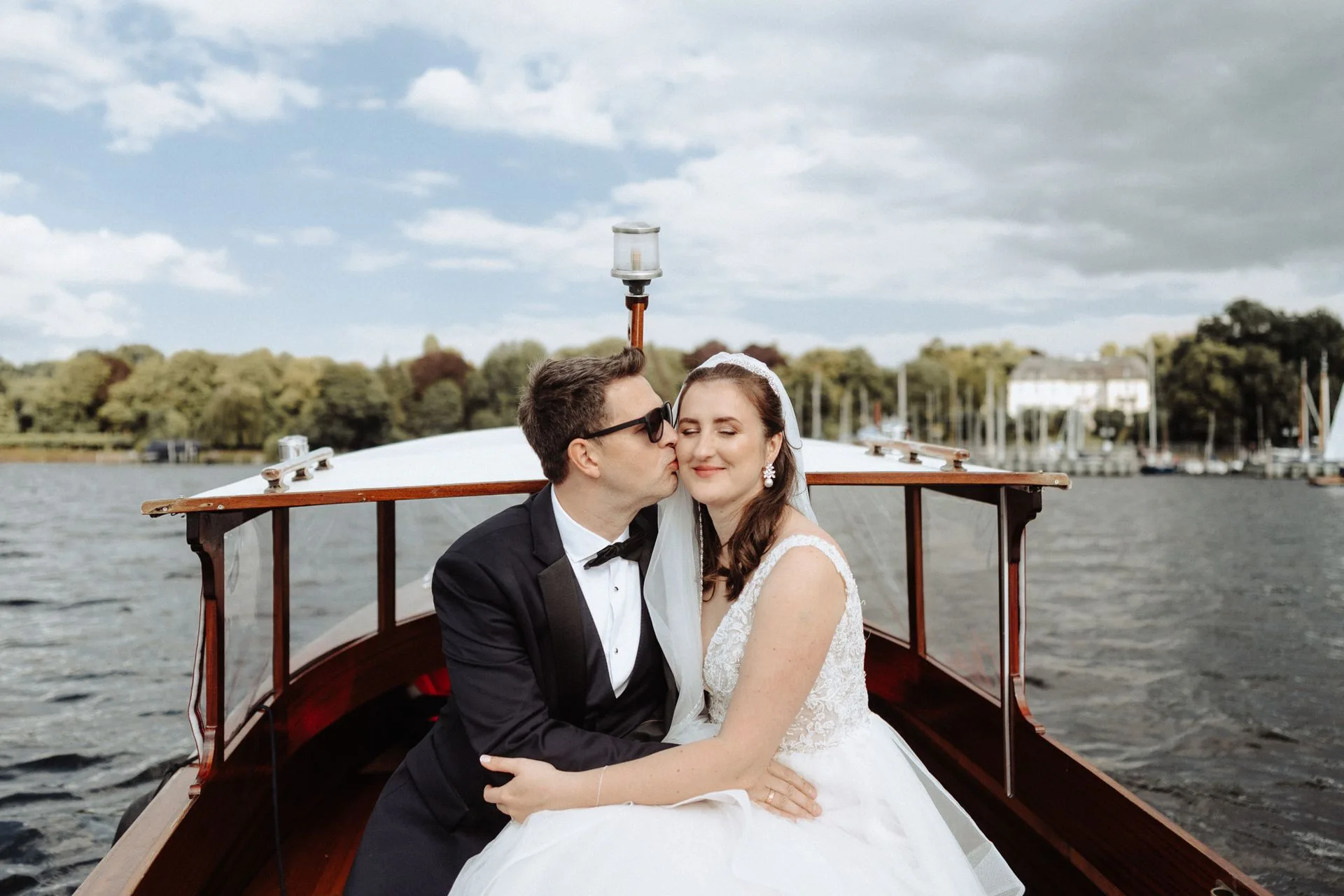 Couple in a wooden boat on the water